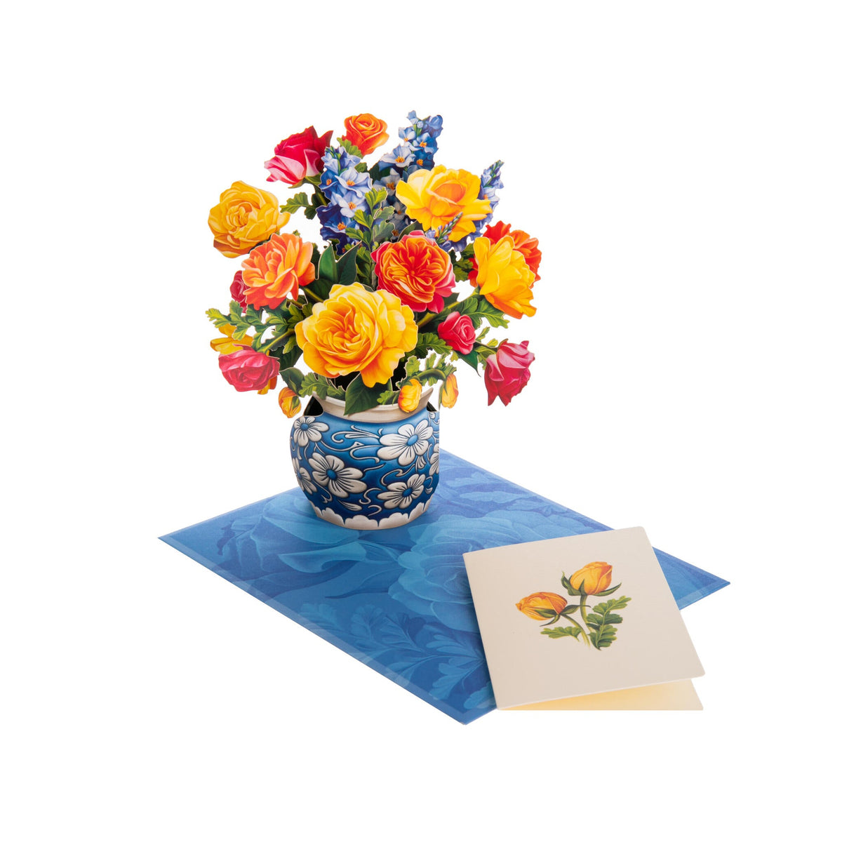 Colorful bouquet of flowers in a blue vase on a white background