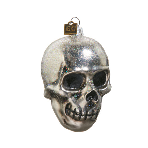 When you love spooky ornaments but also like a bit of sparkle! This glass skull ornament is ready to add just the right amount of hauntingly beautiful bling to your Halloween decor. Hand finished & glittered glass ornament Dimensions: 2" x 3.25" x 3.25".