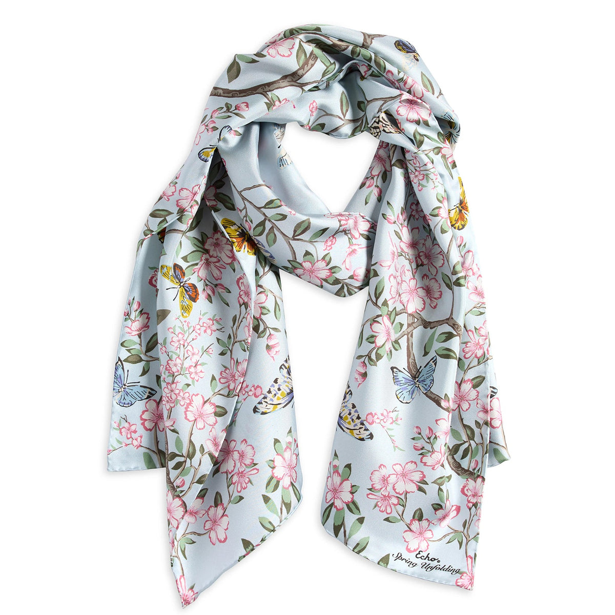 Floral and butterfly patterned scarf on a white background