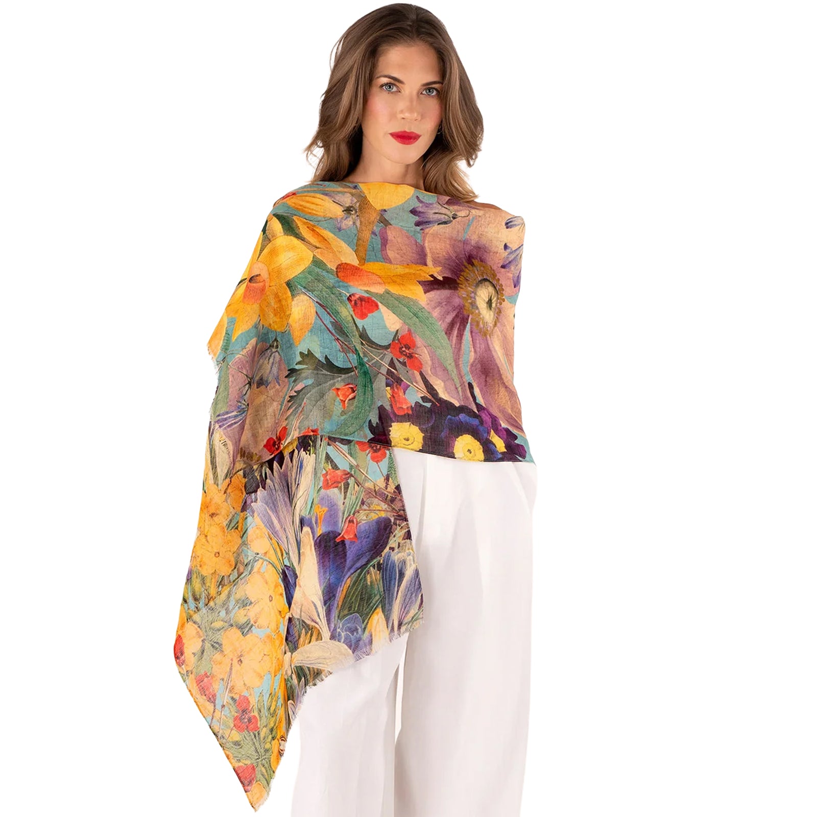 Woman wearing a colorful floral-patterned scarf on a white background