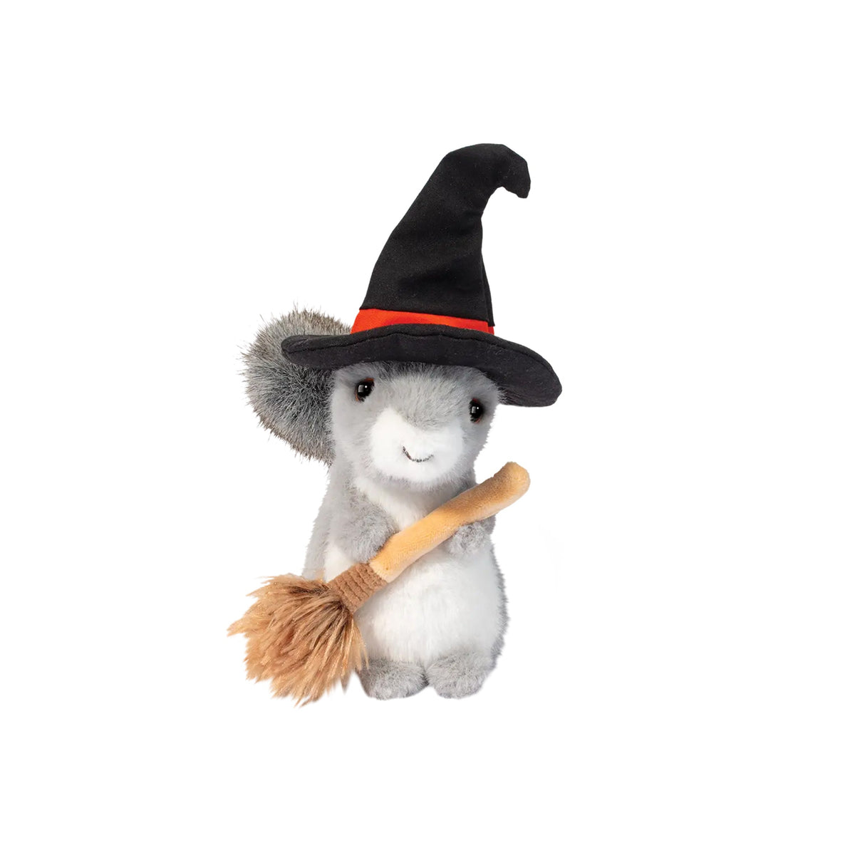 A plush toy of a gray and white squirrel dressed as a witch, wearing a black pointed hat with a red band and holding a small broom, isolated on a white background.