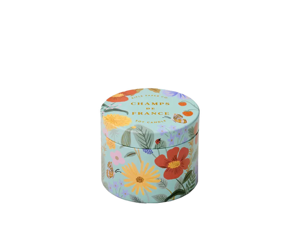Champs de France transports you to the lavender hills and herb-filled markets of the South of France for a scent that is calming, invigorating, and earthy. Candle comes in a lidded tin with a strawberry and wildflower design. Scent: Lavender, sage, rosemary and bergamot. Soy wax. 12 hour burn time. 3 oz. Travel size.