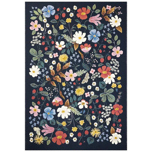Whether it's styled indoors or out, on patios or in mudrooms, hallways, or playrooms the vibrantly colored flowers and strawberries on this playful rug makes it a standout piece, wherever you decide to put it. The rug is power loomed of polypropylene and polyester for durability and weather resistance