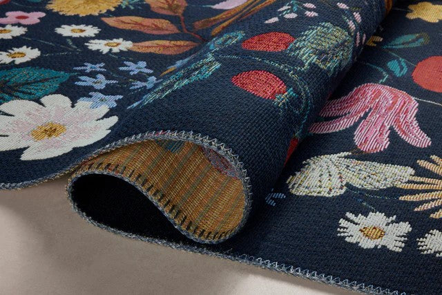 Whether it's styled indoors or out, on patios or in mudrooms, hallways, or playrooms the vibrantly colored flowers and strawberries on this playful rug makes it a standout piece, wherever you decide to put it. The rug is power loomed of polypropylene and polyester for durability and weather resistance