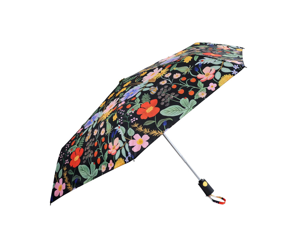 Why have a gloomy umbrella when you can have bright and sassy instead! The chic black base is adorned with spring blooms and sweet strawberries, which are sure to put you in a sunny mood, even on the rainiest days. 43" open diameter 11⅛" closed length Auto open and close button Plastic handle with wrist strap.