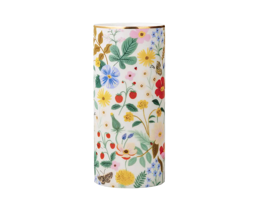 Flowers for your flowers. This porcelain cylinder vase features a sweet 'Strawberry Fields' blooms and berries print with a gilded rim for extra shine. Porcelain Full-color illustration with metallic gold accents 7" tall. 3.125" D Box: 4" x 4" x 7.75" Hand wash or wipe clean with damp cloth.