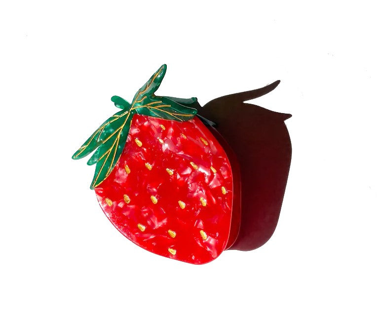 Clip up your hair in the sweetest of ways with this Strawberry hair clip. It is double sided for a perfect look from every angle. Unlike most plastic accessories, these small-batch styles are made from a biodegradable wood pulp acetate, making these clips both beautiful and kind to the environment! Size: 2.25" x 2".