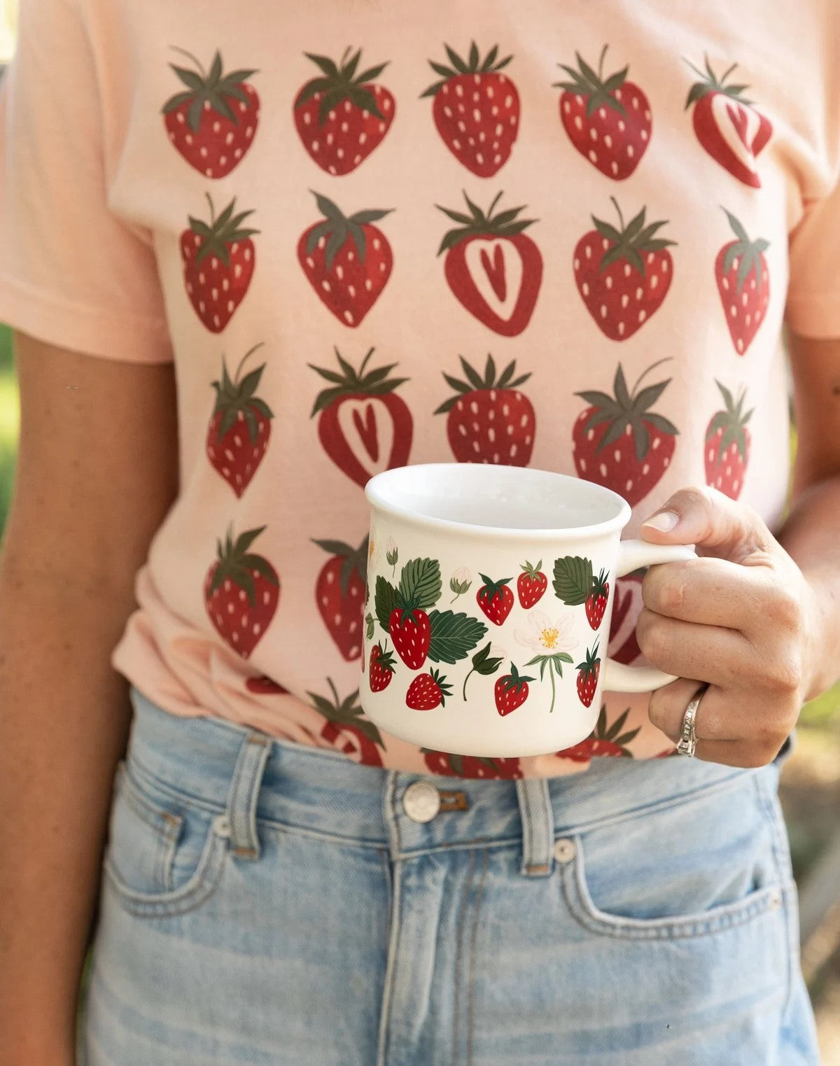 Enjoy your favorite beverage in style with this charming Strawberry Patch Mug. Featuring a hand-illustrated design of ripe strawberries and delicate white blossoms, this mug brings a touch of the garden to your kitchen. 