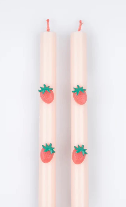 Strawberries are a fruity, summery design trending right now. These decorative candles are perfect to enhance any party table, or place on the mantel. Light for a warm glow or display and reuse again and again. The soft pink teams beautifully with the red strawberries for a modern touch. Look closely and you'll see the wicks are colored red, it's this attention to detail which makes these tall candles ideal as a host gift too. Straight pink table candles with red wick. Wax strawberries are attached to the c