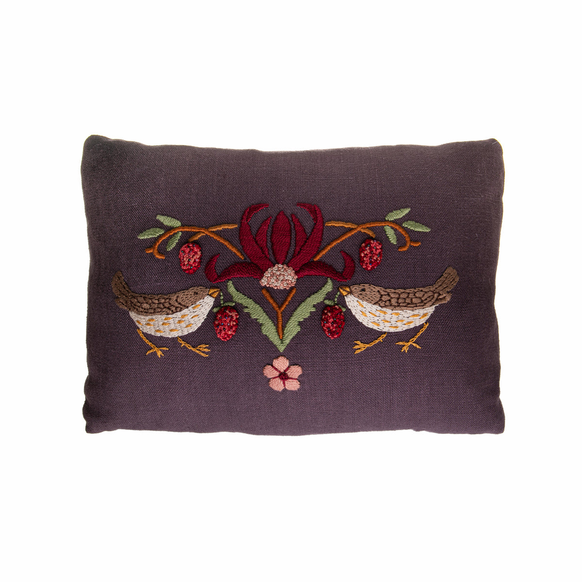 Decorative pillow with embroidered birds and flowers on a white background