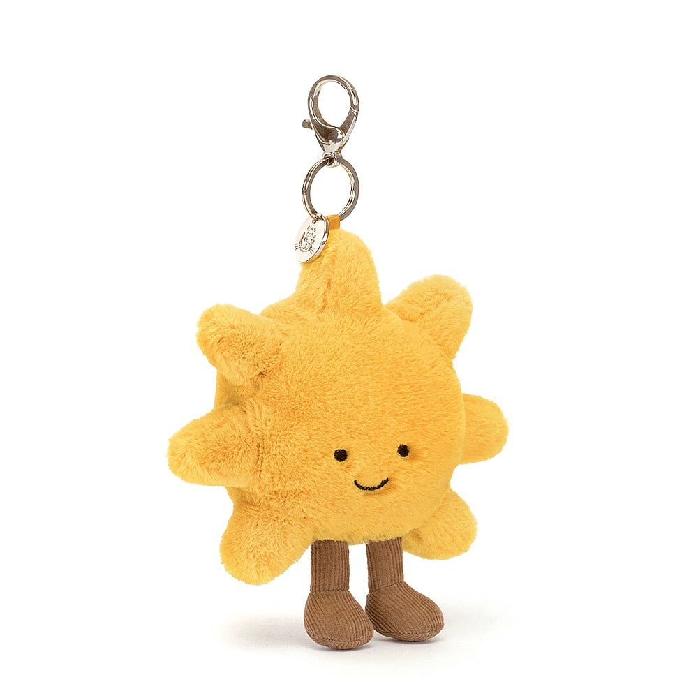 Brighten up that gloomy backpack with the Amuseable Sun Bag Charm! This smiling sun is cosy and golden, with a silver chain and claw clip, Jellycat disc and milk chocolate corduroy boots. Dimensions: 8" x 6" Recommended for 3 years + due to small parts. 