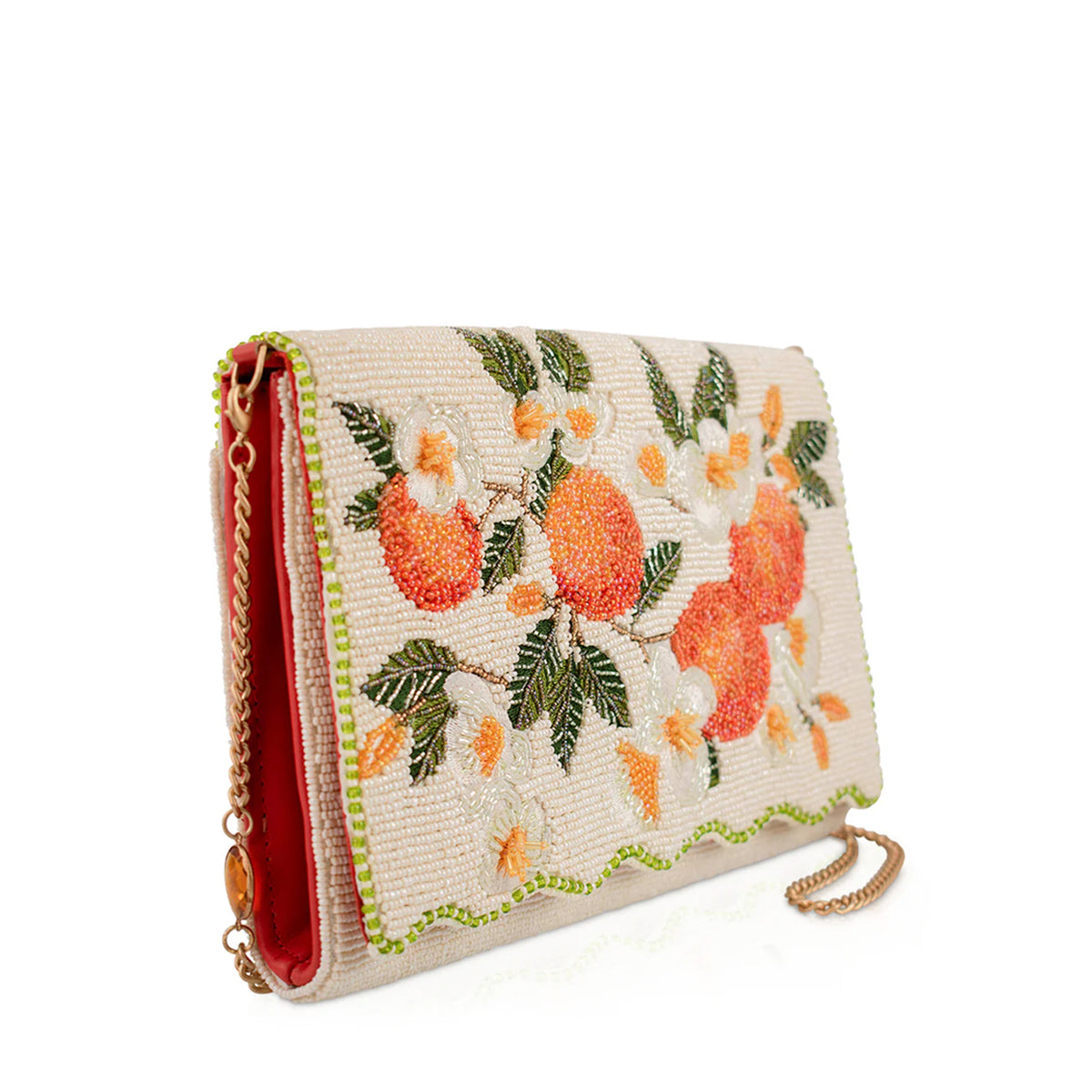 Beaded and embroidered clutch bag with orange design on a white background