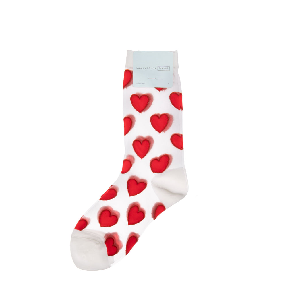 Be sweet from your head to your feet with these heart motif sheer socks. This top-notch pair has a super high needle count for detailing and a hand-closed toe for extra comfort. Materials: High needle count, durable nylon. Made in Japan. Size: Womens US size 6 - 9.5.