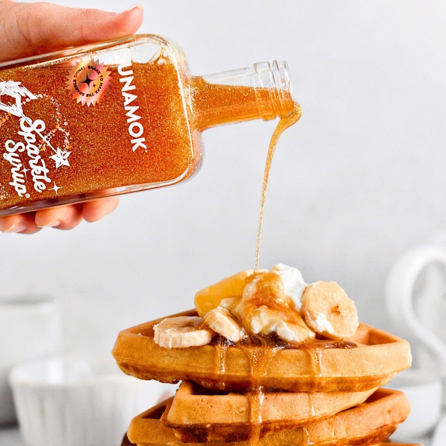 Bottle of Runamok Sparkle Syrup on a white background