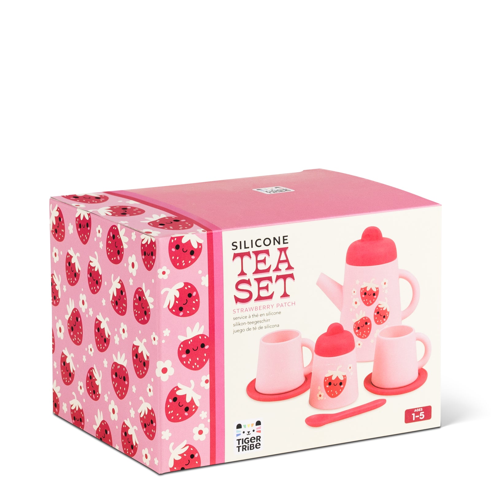 A pink and red silicone tea set with strawberry designs, including a teapot, cups, saucers, a sugar bowl, and a spoon.