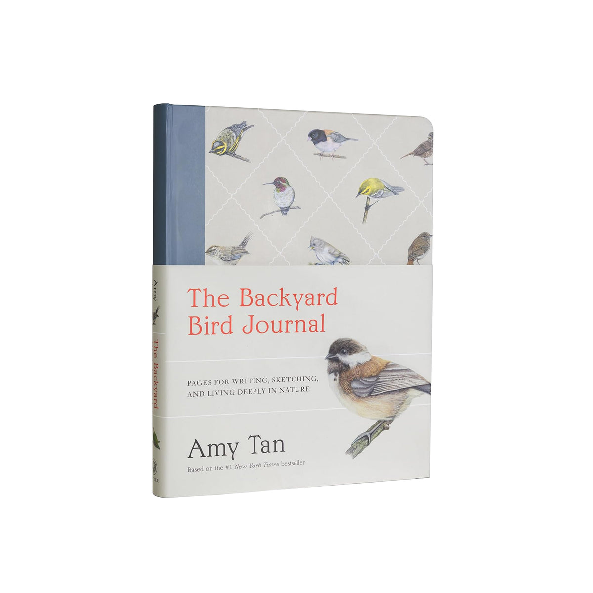 Book titled 'The Backyard Bird Journal' by Amy Tan with bird illustrations on a white background