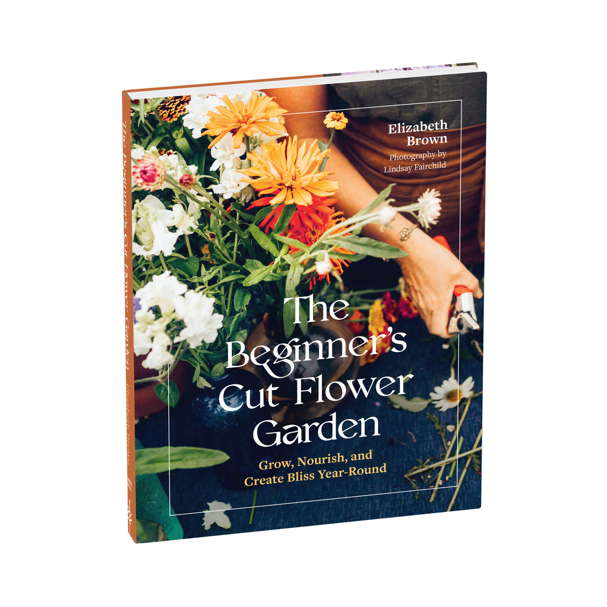 The Beginner's Cut Flower Garden book by Elizabeth Brown, featuring a cover with a photograph of a hand holding flower shears and a colorful bouquet, set against a plain white background.