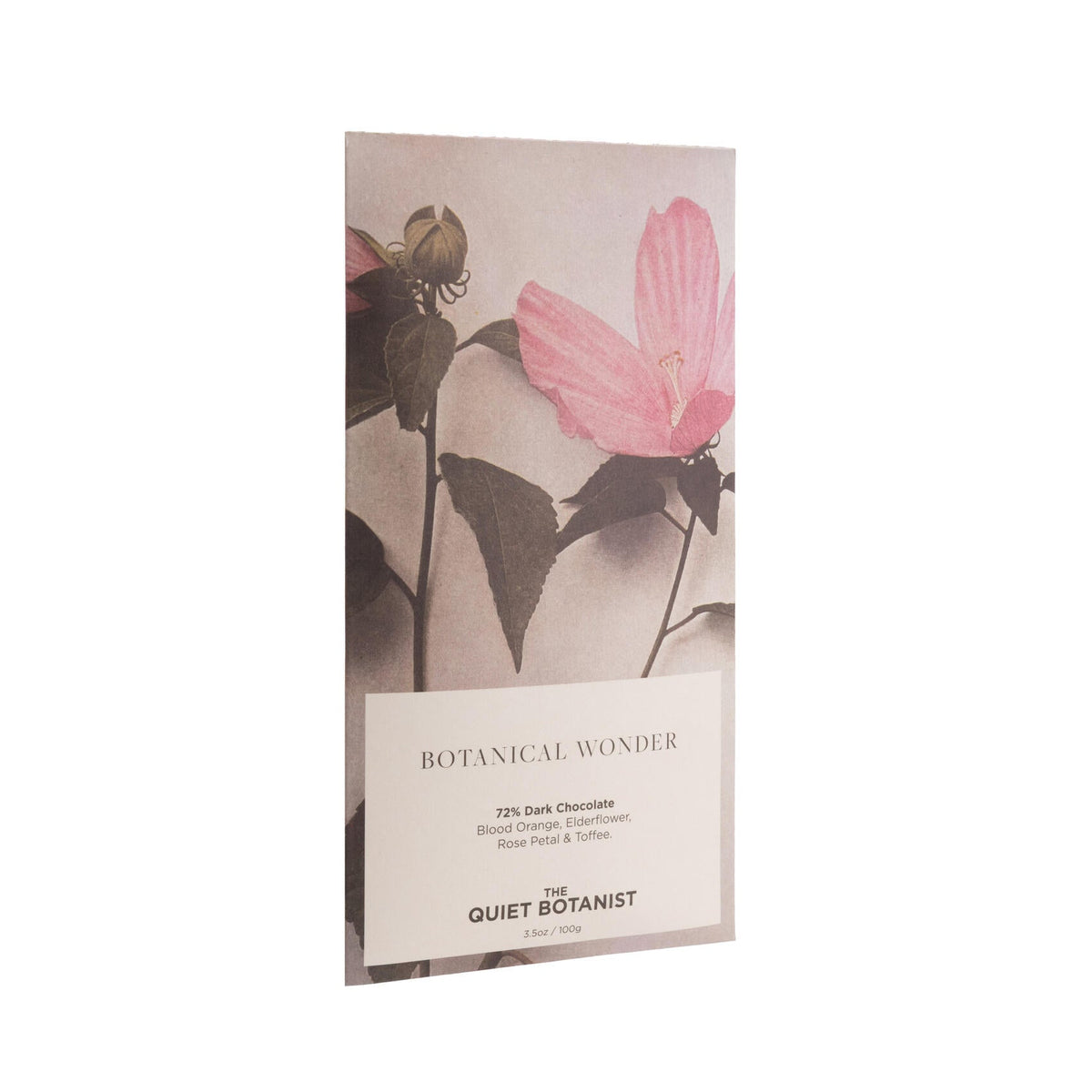 Dark chocolate bar in decorated packaging with a pink flower design on a white background