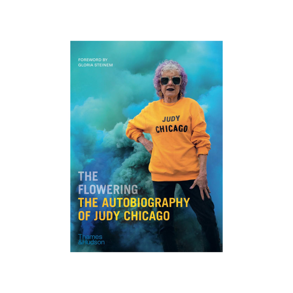 Book cover of 'The Flowering: The Autobiography of Judy Chicago' with a person wearing a yellow sweater.