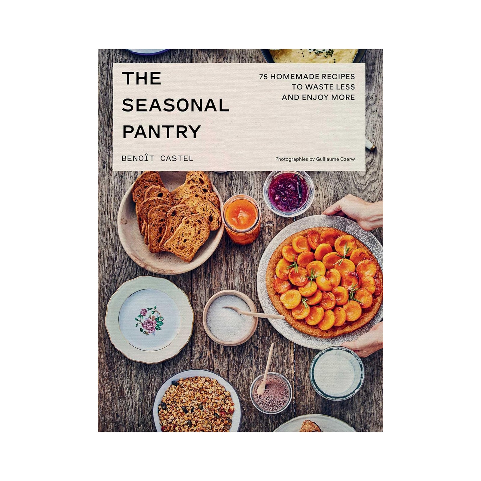 Book cover of 'The Seasonal Pantry' with food images on a wooden table.