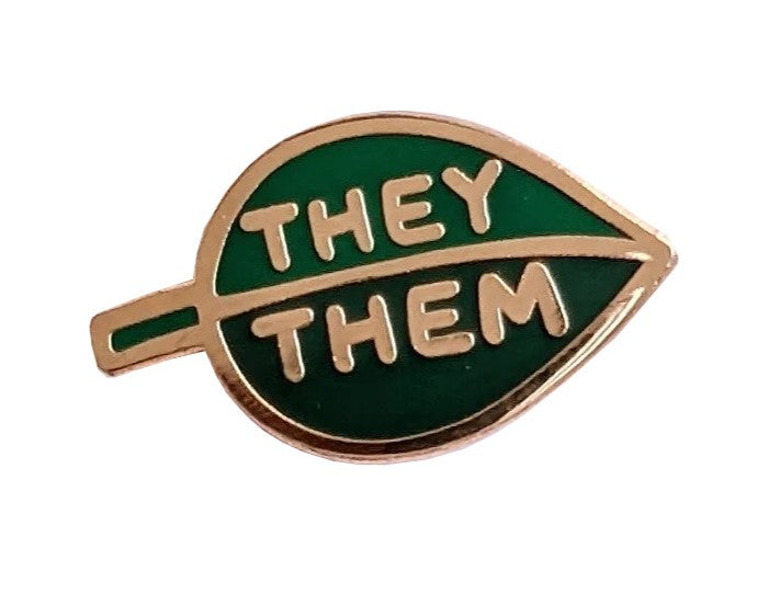 This two-tone enamel leaf they/them pronoun pin allows you to communicate your preferred pronouns in a cute and subtle way. Pin to lapels, backpacks, sneakers and more! Materials: metal and enamel Pin fastening with rubber stopper Dimensions: 1" x 1.5"