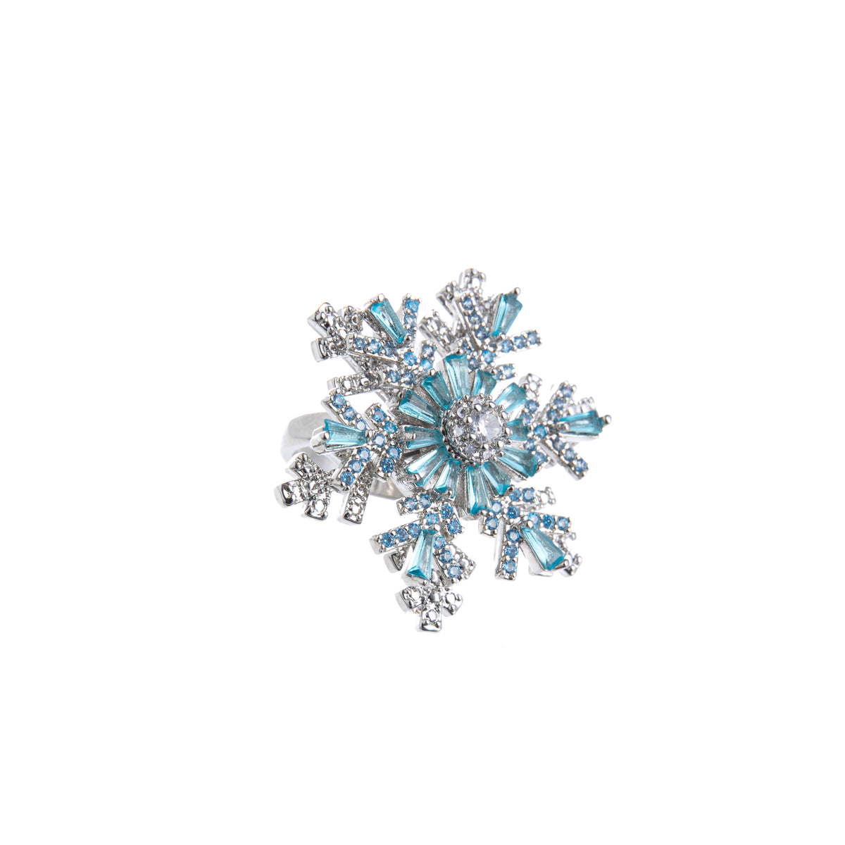 Decorative snowflake ring with blue and clear gemstones on a white background