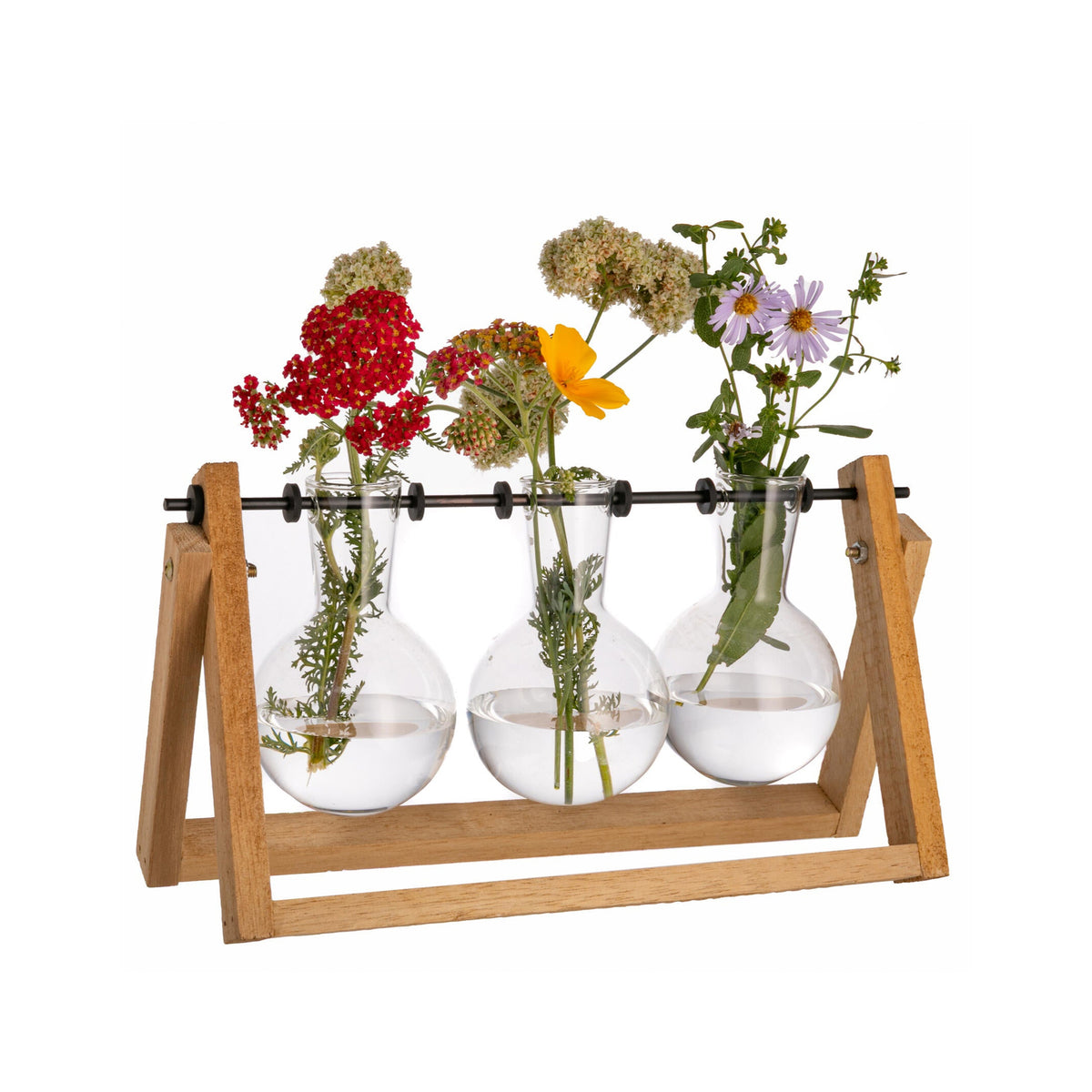 Three glass bulbs with flowers on a wooden stand against a white background