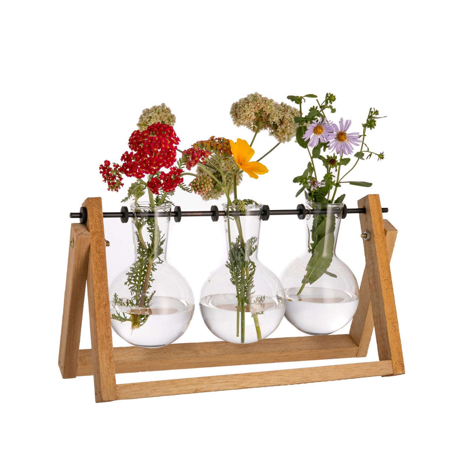 Three glass bulbs with flowers on a wooden stand against a white background