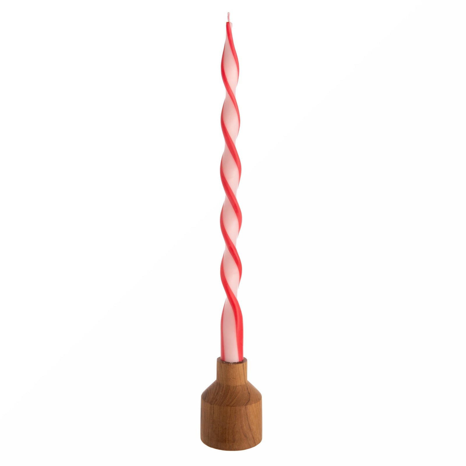 Twisted candle with wooden base on a white background