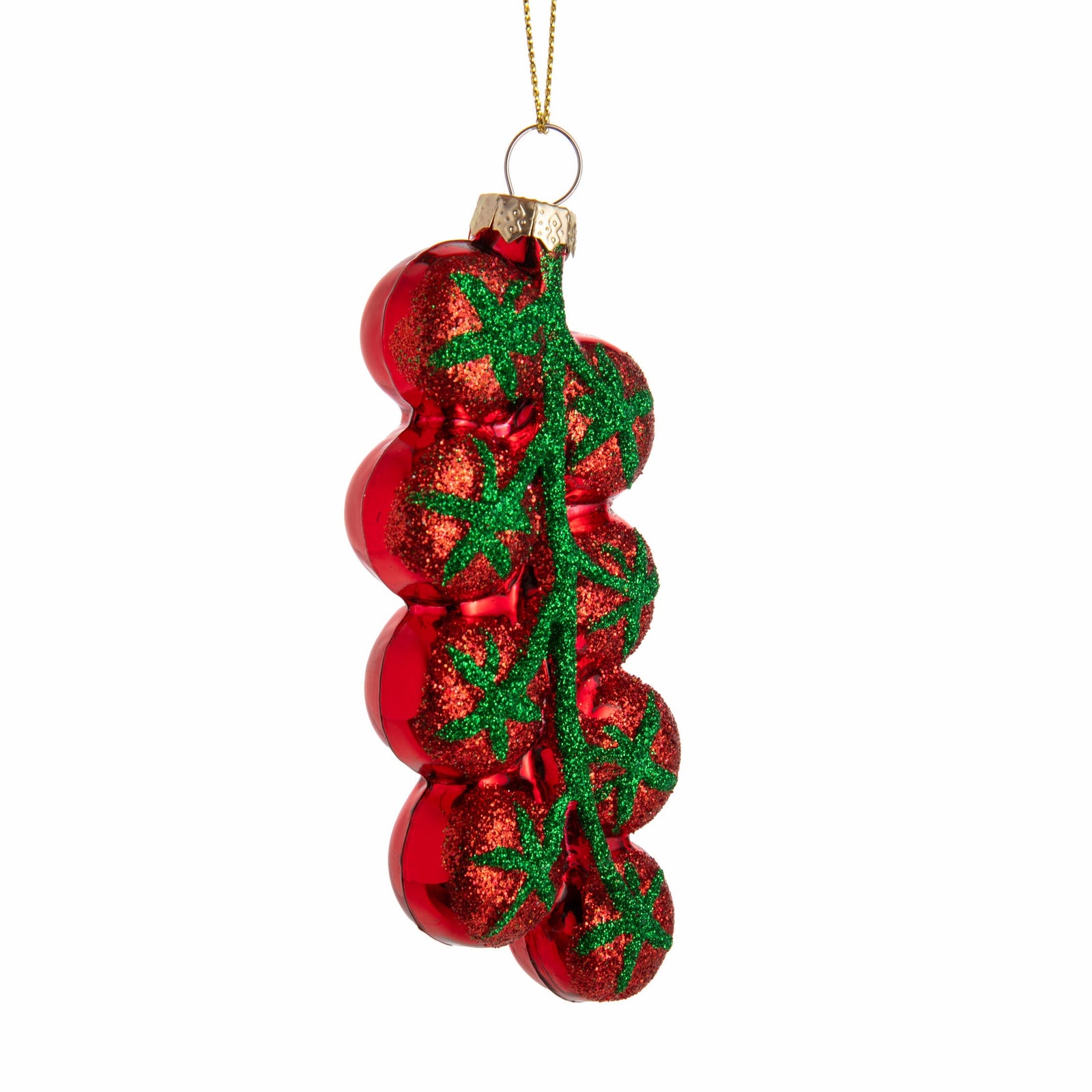 Red glass tomato Christmas ornament with green vine on a white background