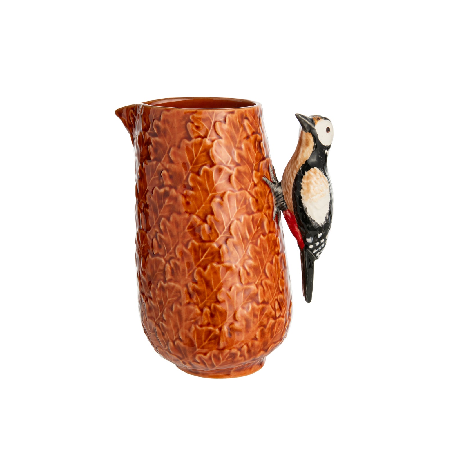 Once you've served drinks from this charming woodpecker pitcher, regular pitchers will look downright dull. This woodpecker perched on a pitcher of leaves is made by master ceramics atelier Bordallo Pinheiro, which was founded in Portugal in 1884. Handmade. Limited edition. 7" L x 5.5" W x 8.25" H Capacity: 50 fl. oz.