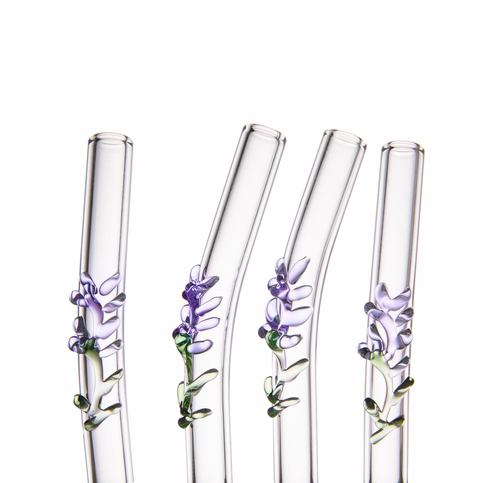 Inspired by a swaying fragrant lavender field in full bloom, these glass straws are each decorated with a glass lavender sprig. These clear, reusable straws are made from borosilicate glass, which is stronger and more break-resistant than regular glass. This pack includes four curved straws and a cleaning brush to keep them sparkling.