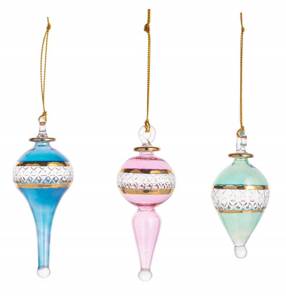 This stunning set of miniature handmade glass ornament will add the most magical touch to any holiday decor. In complimentary pastel tones, each ornament has its own unique shape, and all three feature an etched diamond pattern and are trimmed with gold metallic accents. Set of three. Dimensions approx. 4" x 1.2".