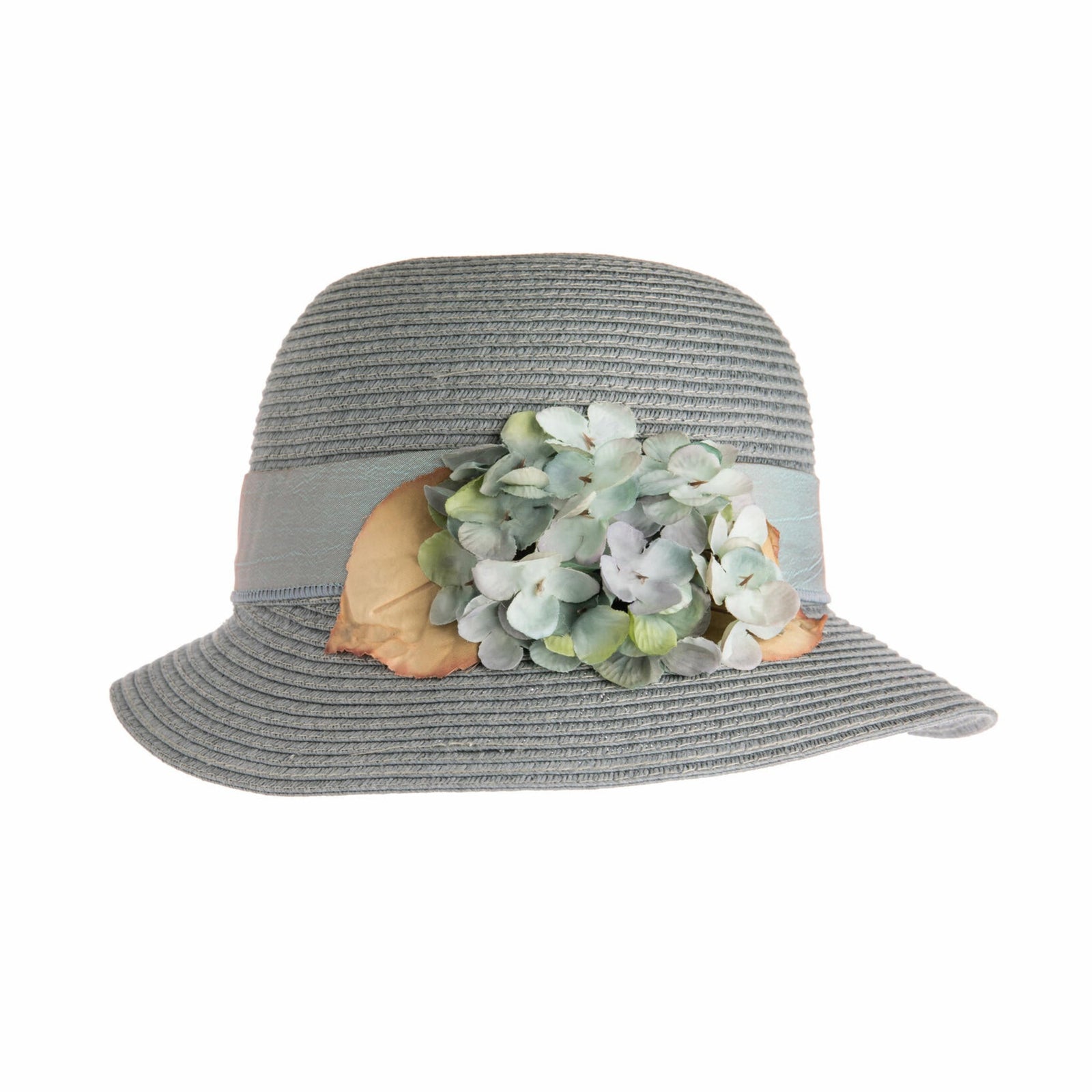 This pretty woven straw cloche evokes lazy summer evenings in an English garden, sipping Pimm's and eating cucumber sandwiches. Made from a durable, breathable and packable paper straw, you can throw it into your beach bag, or keep in your car for whenever you need some extra stylish sun protection. With an elegant asymmetrical cloche shape, this hat features a delightful Hydrangea trim and a classic silk hat band