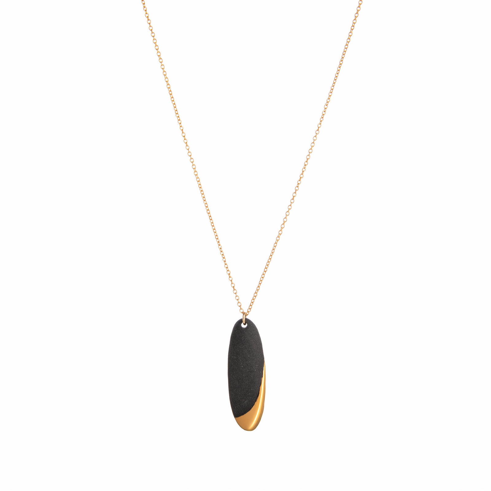 Necklace with a black and gold pendant on a white background