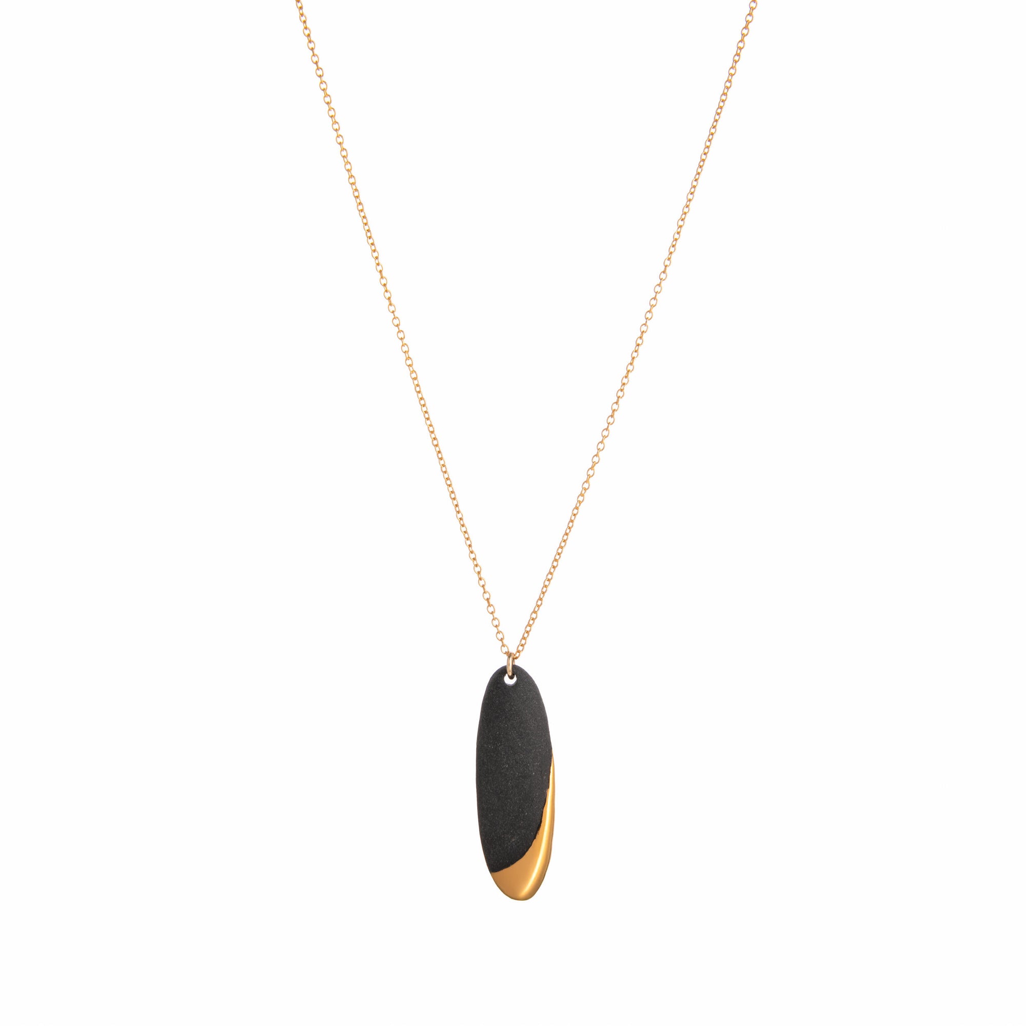 Necklace with a black and gold pendant on a white background