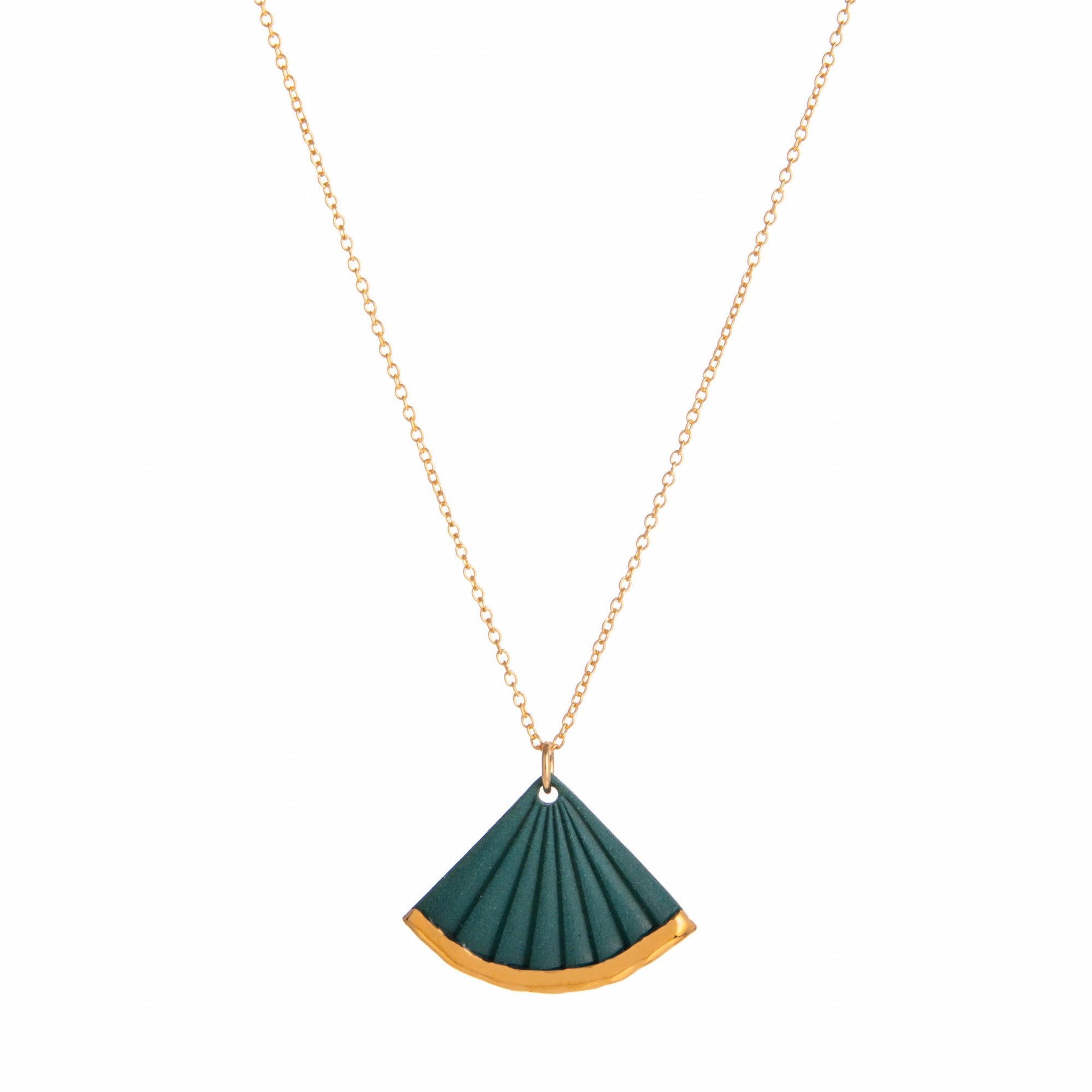 Green fan-shaped pendant on a gold chain against a white background