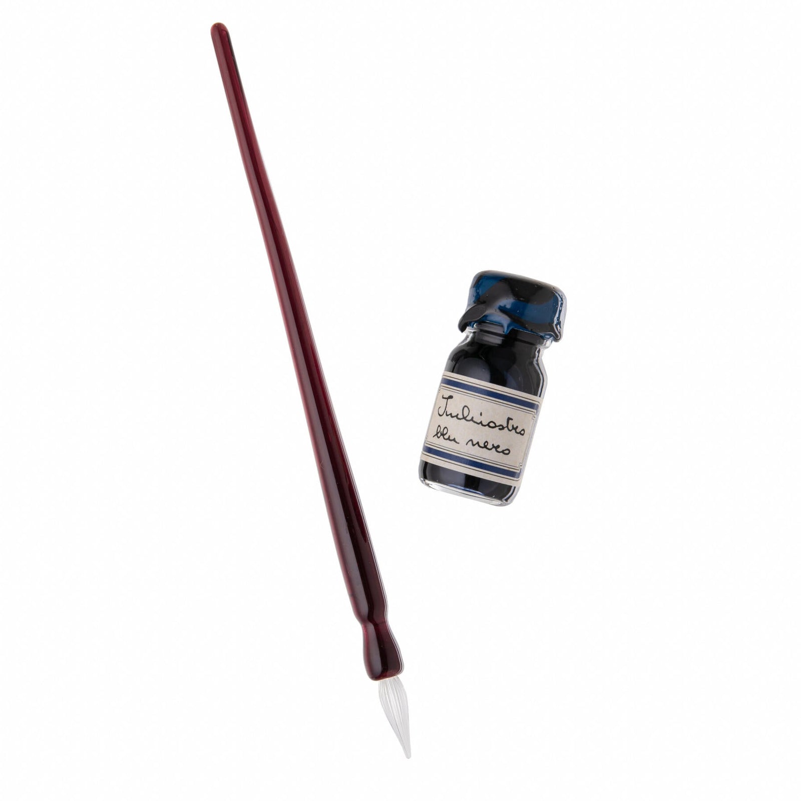 Pen and ink bottle set in a decorative box with a pink ribbon on a white background