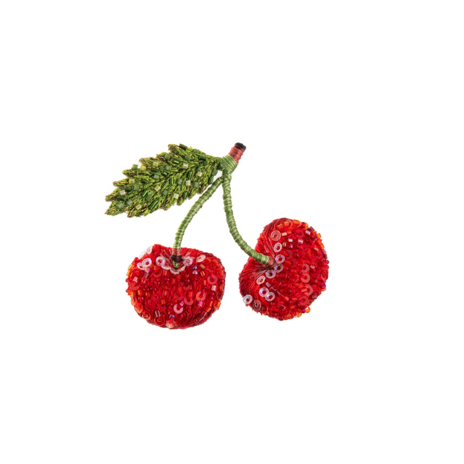 Decorative red cherries with green leaves on a white background