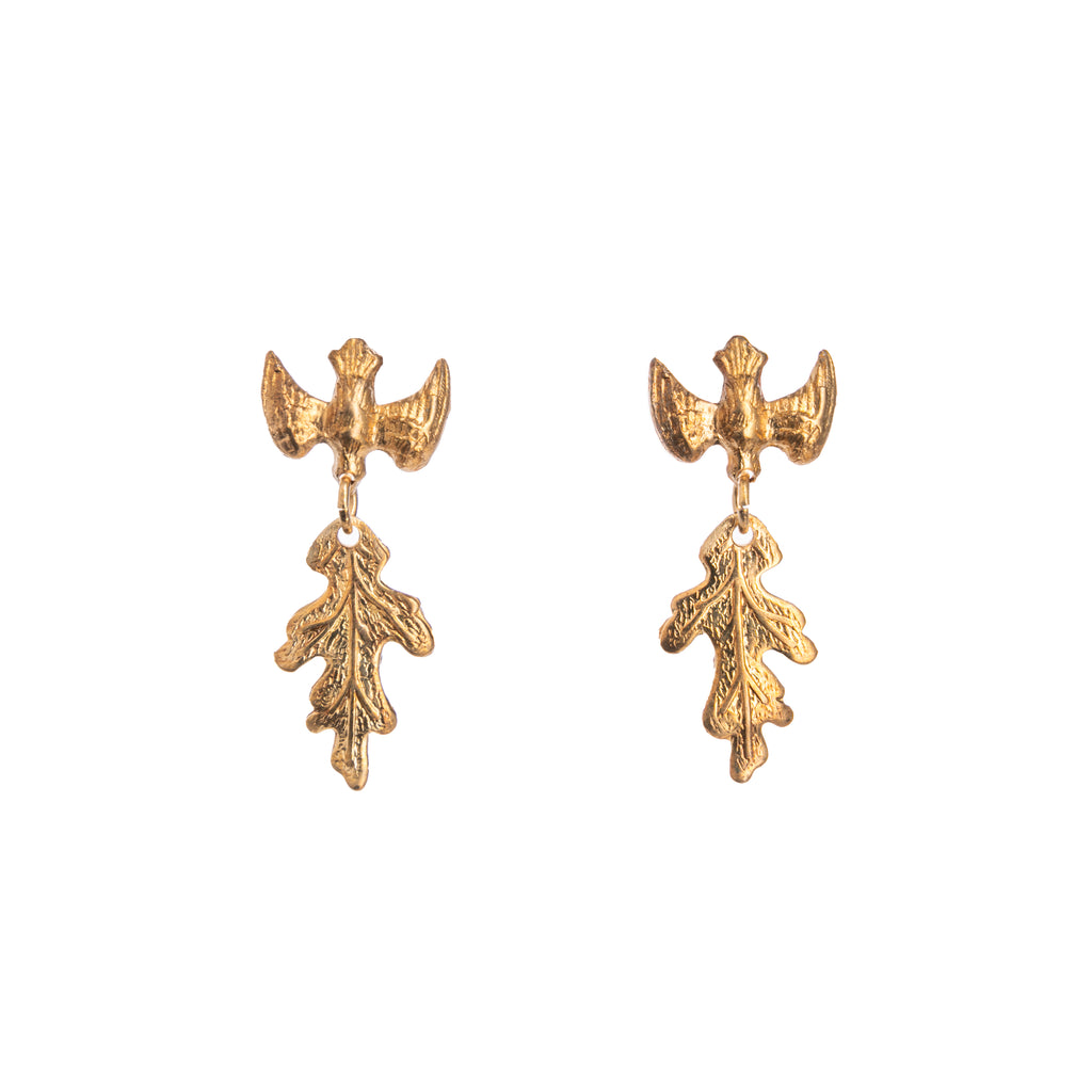 These little parula birds fluttering above oak leaves are the sweetest gold earrings. Small enough for daily wear but still add a flash of gold glamour for evening. Perfect for bird lovers and nature lovers alike.  Dimensions: 1.25" long Material: Gold-plated brass  Nickle and lead-free