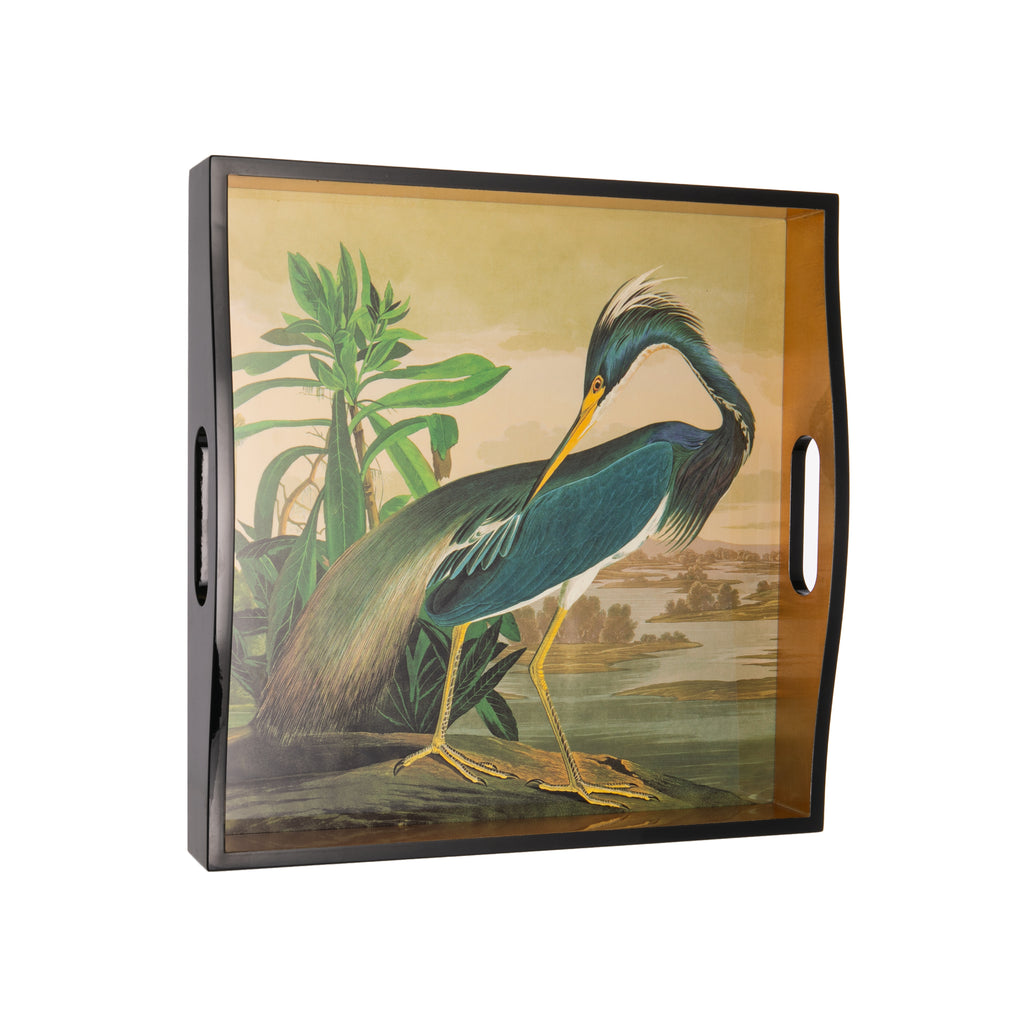 Elegant blue heron painted serving tray. With real gold leaf details, this tray would look fabulous as a decor piece in the kitchen, or as a housewarming gift to a loved one. Around 1820, Audubon decided to undertake painting every bird found in North America. He completed this collection of paintings in 14" x 14".