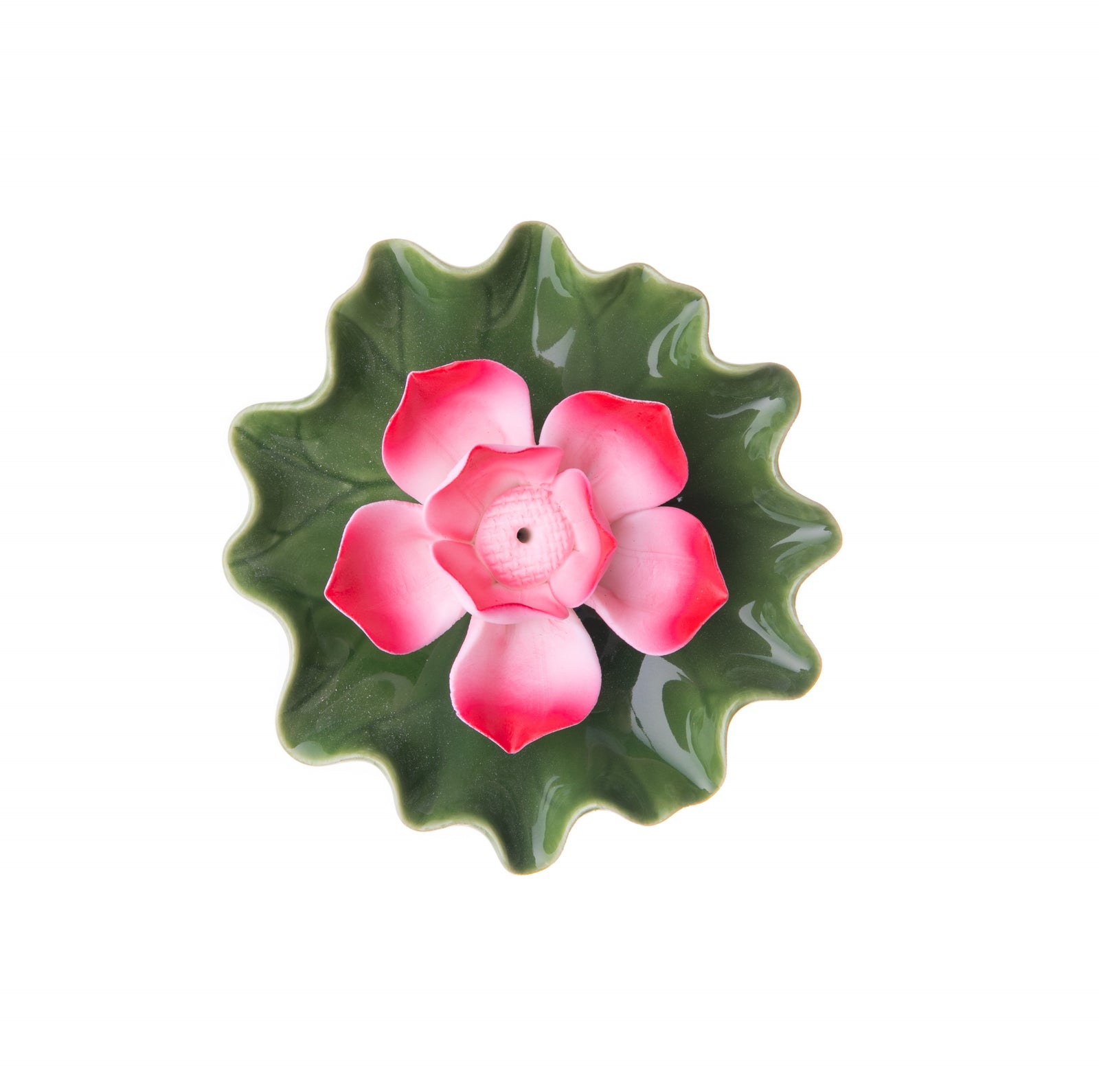 In some cultures, the lotus flower is seen as a symbol of strength and resilience. You can bring this powerful symbol into your home with this Pink Lotus Incense Burner. Center your incense stick in the middle of the lotus flower and be transported to a meditative lotus pond. Dimensions: 3.5" x 1.3" Material: ceramic.