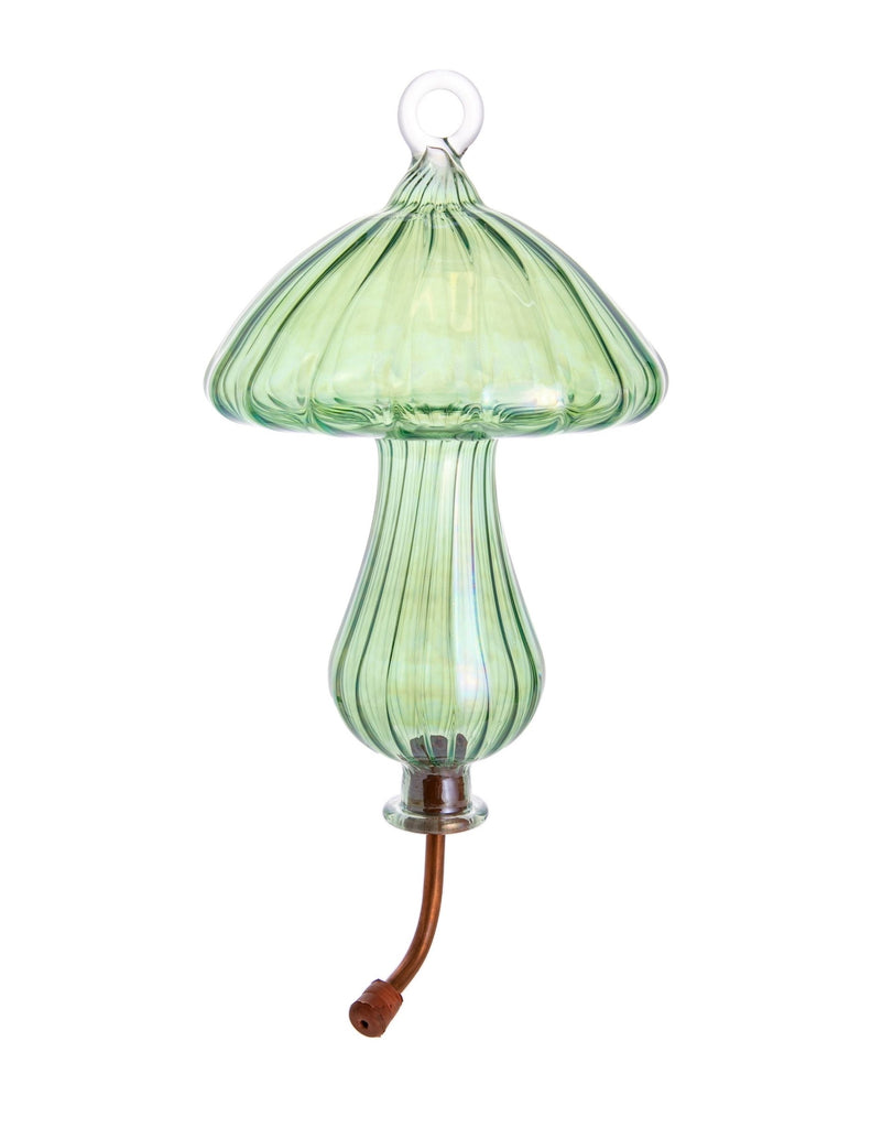 The prettiest hummingbird feeder you will find! This mushroom shaped, hand-blown glass feeder catches the light beautifully and will enhance any corner of your garden, whilst attracting and feeding delightful hummingbirds. Hand-blown glass Available in three gorgeous colors. Dimensions: 10" x 6".