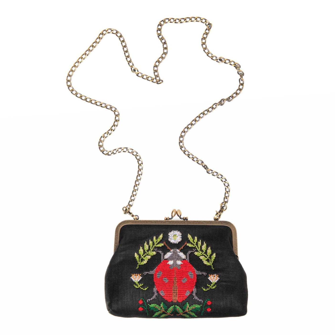 Embrace whimsical charm with this delightful ladybug cross stitch vintage style purse. This fabulous accessory combines playful design with an adorable ladybug motif. This bag is perfect for those who appreciate unique and eye-catching fashion pieces.