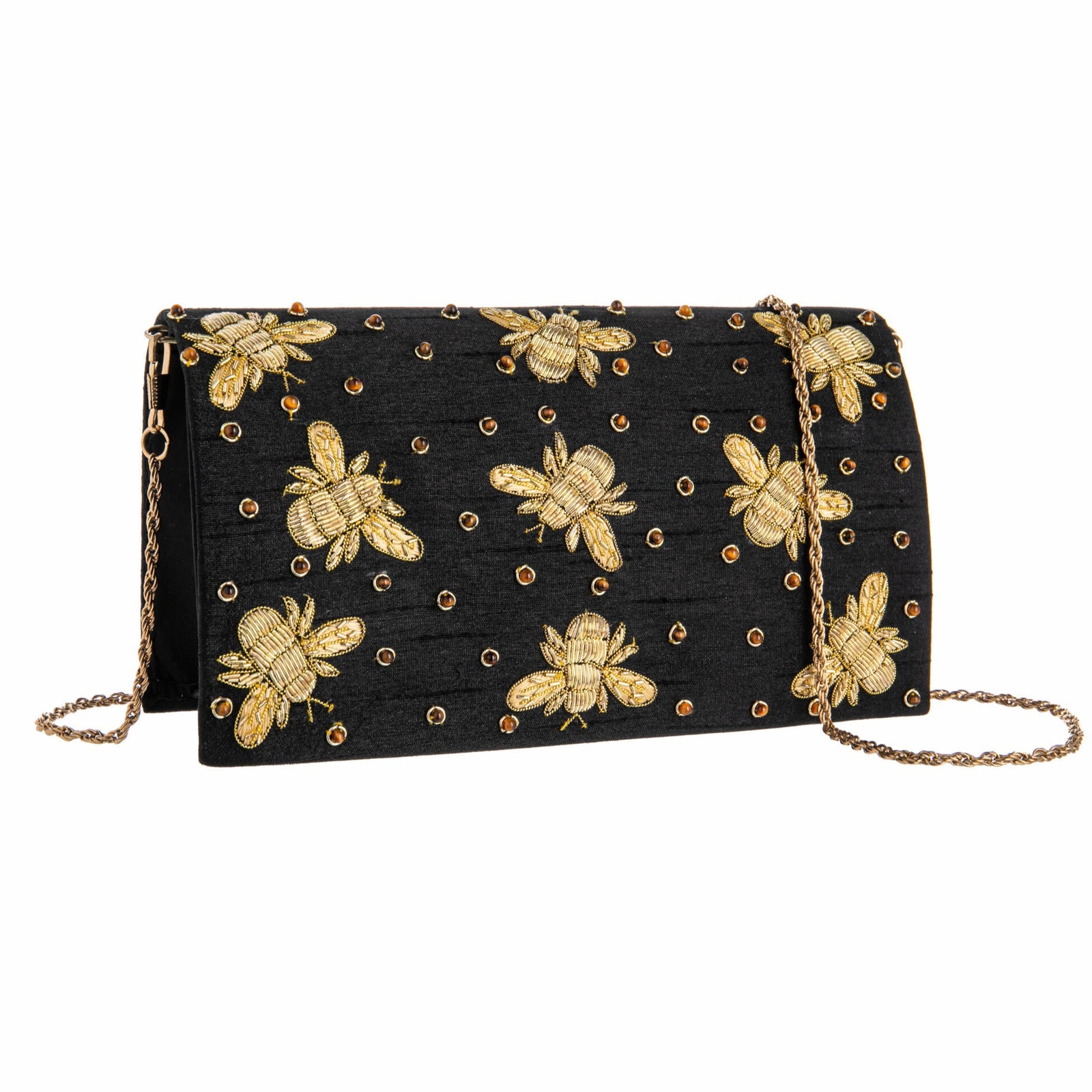 Black clutch bag with gold bee patterns on a white background