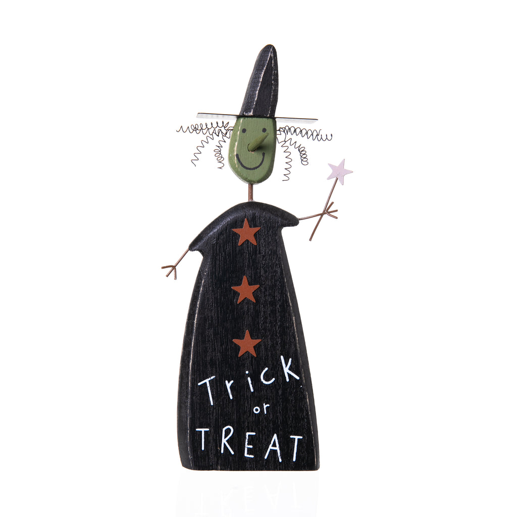This wooden witch chunky sitter lends a hand lettered "Trick or Treat" sentiment and includes painted and metal accents including wand and coiled hair. Features muted green, black and orange palette, making a spooky yet sweet addition to your Halloween display. Wood, metal, wire. Hand painted. Size :4" x 8" x 1".