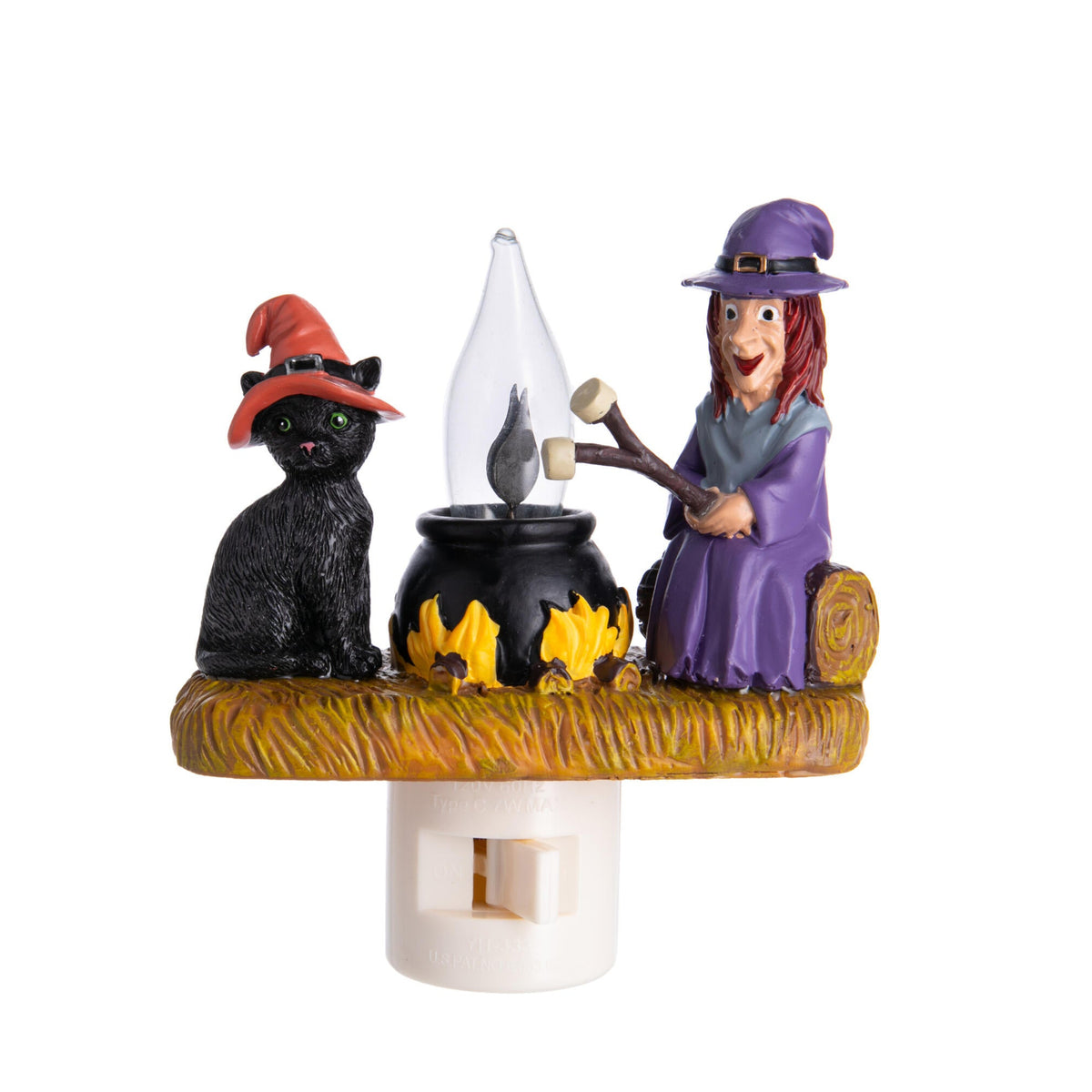 Halloween-themed night light with witch, black cat, and cauldron on a white background