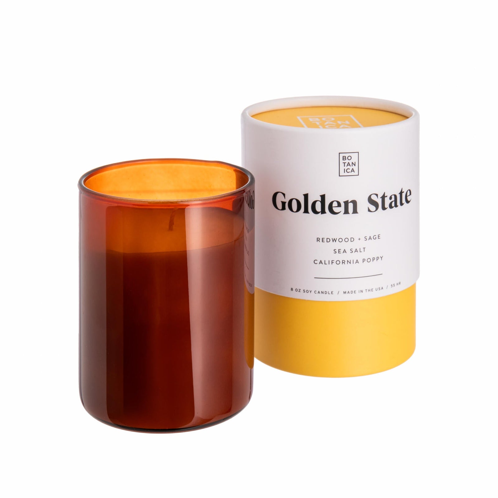 Brown candle in a transparent container with a white label on a white background