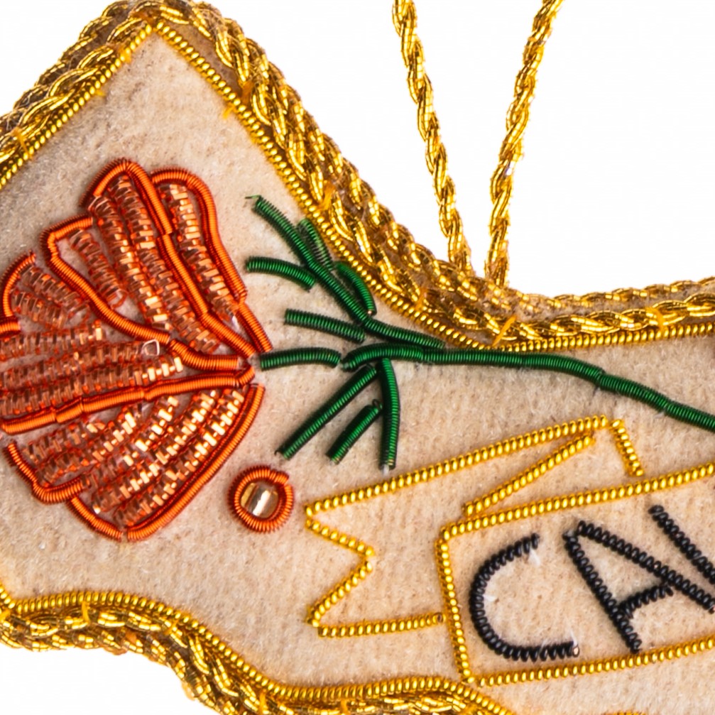 Decorative ornament shaped like the state of California with floral designs on a white background.