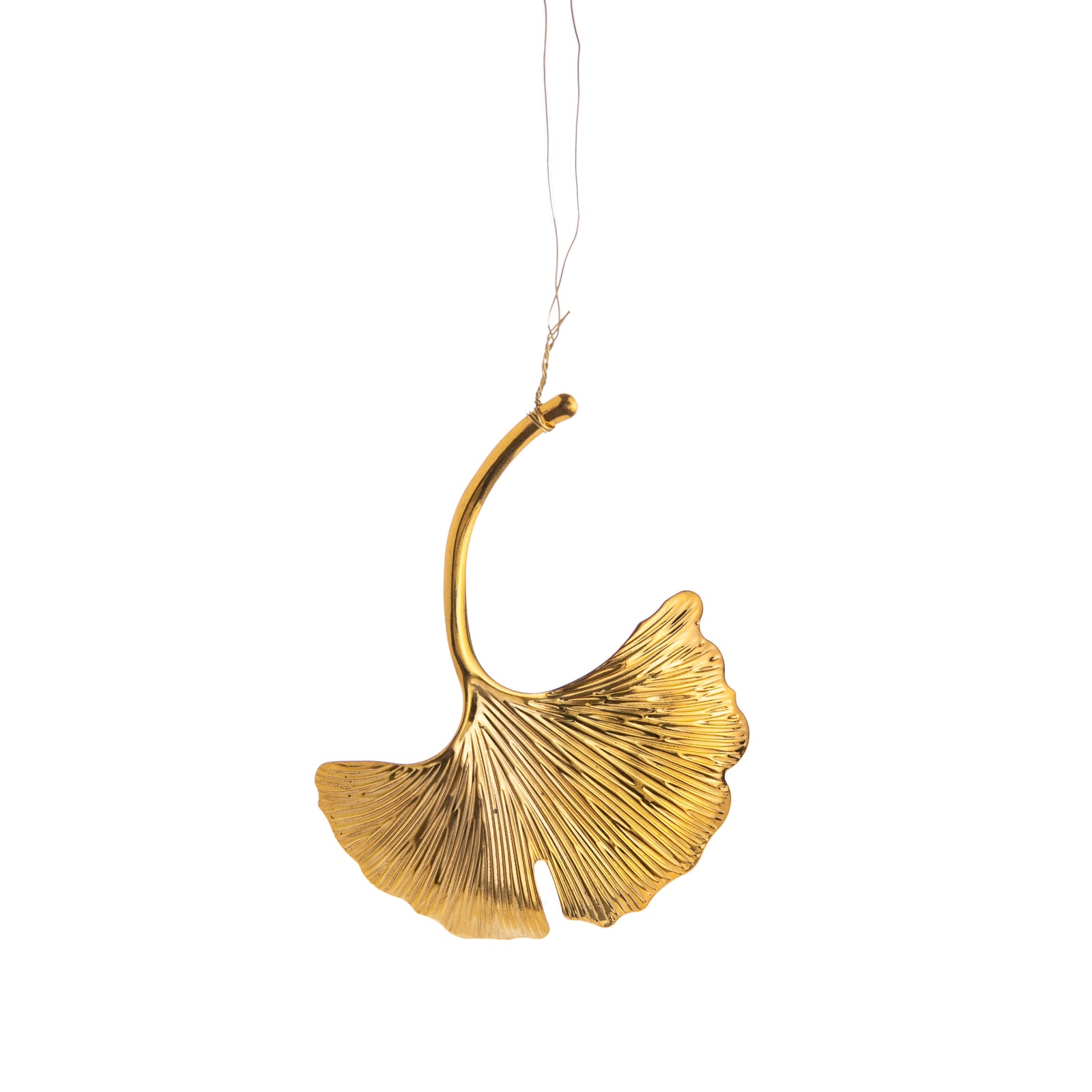 Gold ginkgo leaf-shaped ornament on a white background
